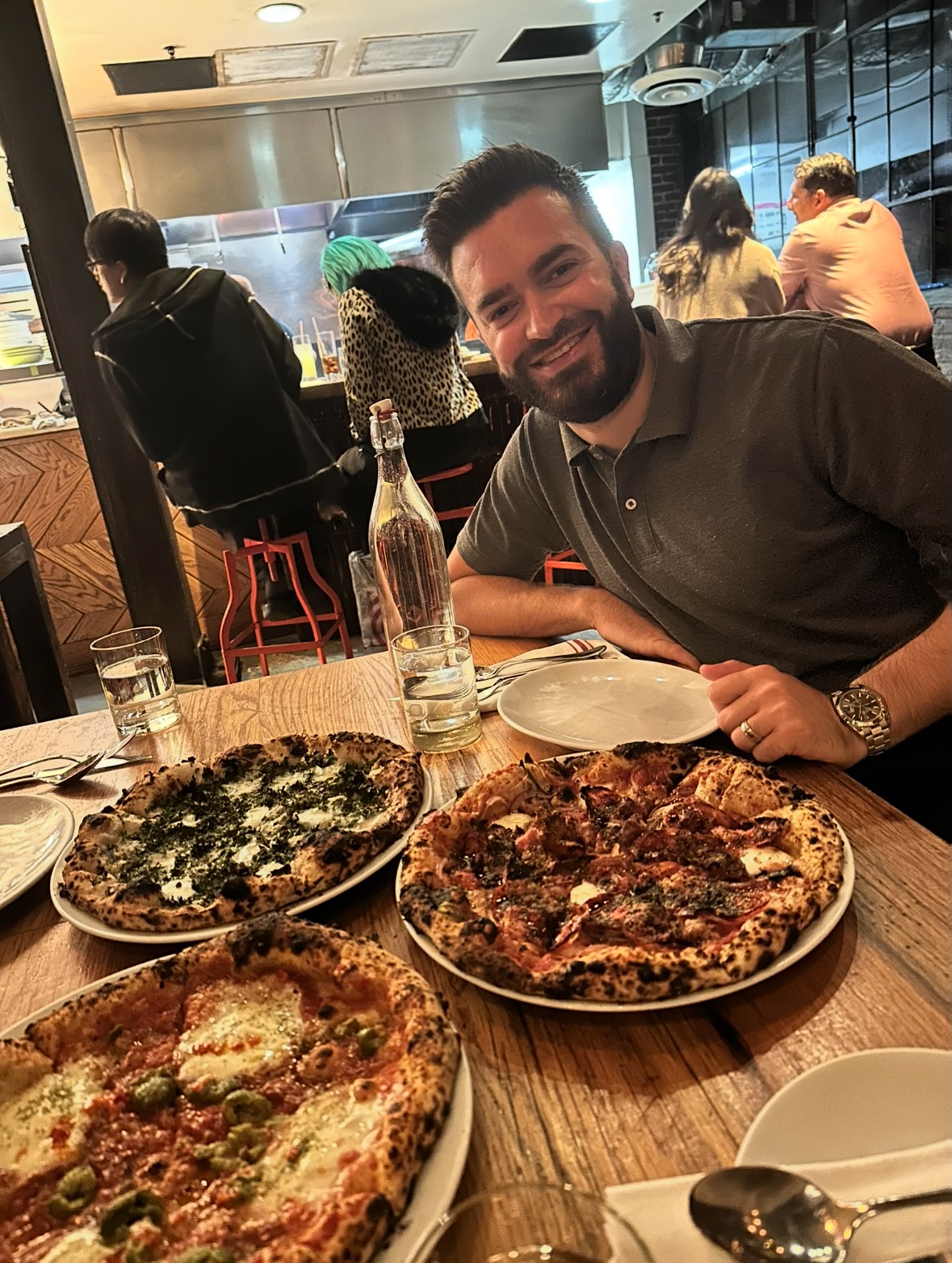 Miguel with pizzas